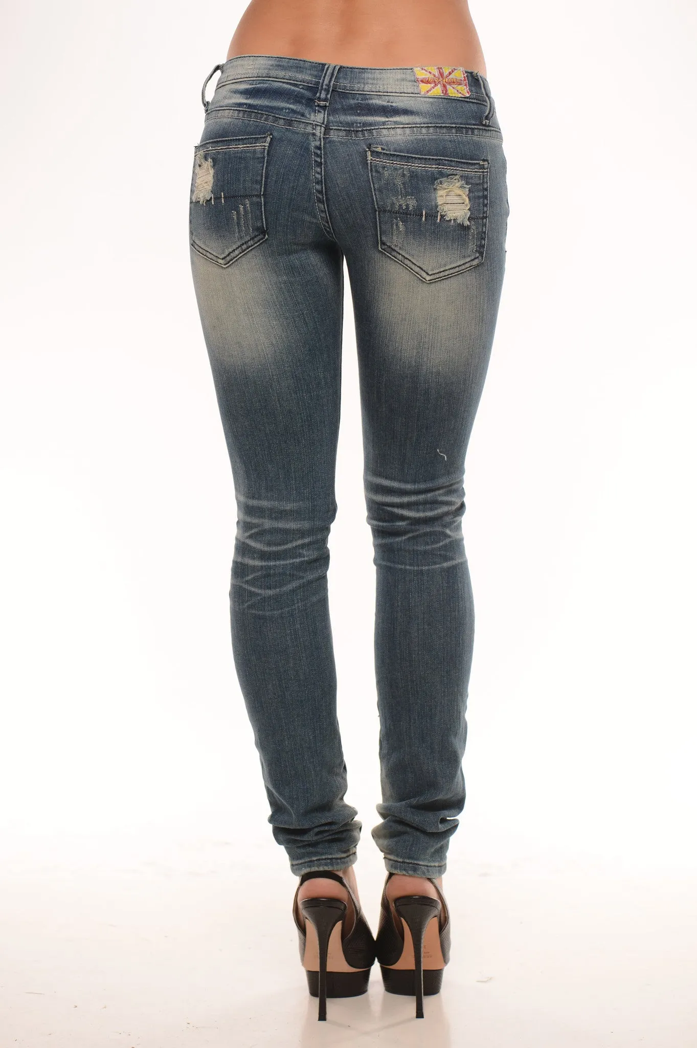 Totally Distressed Low Rise Skinny - Medium Wash